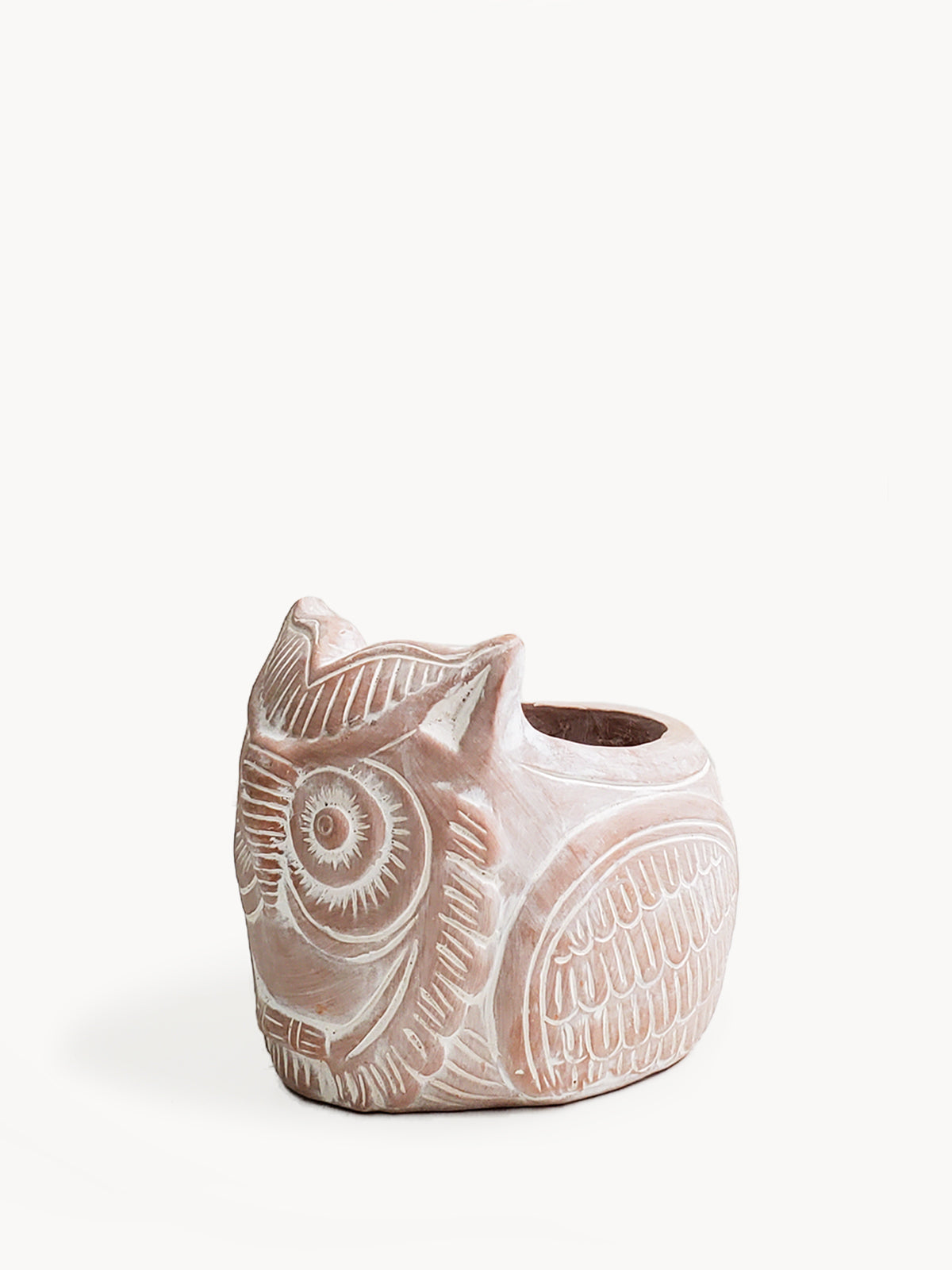A terracotta pot in the shape of a horned owl, with a natural beige color.