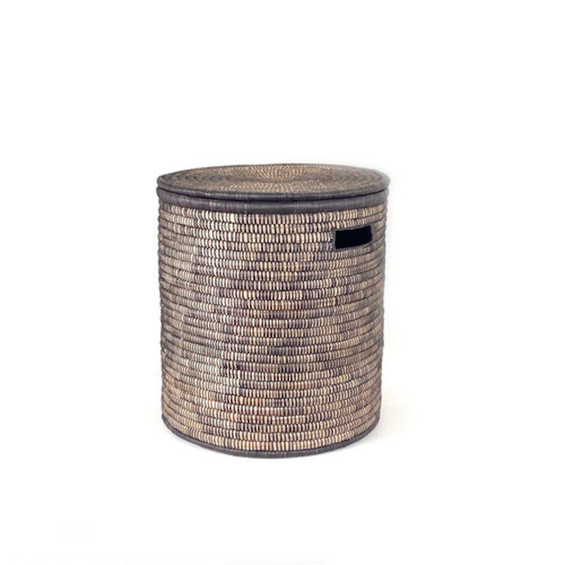 A medium-sized Black Malawi Basket made of woven palm leaves with a flat lid, featuring a monochromatic black and natural color design.