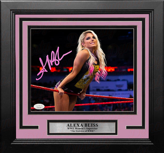 Framed photo of a wrestler with pink accents and signature, featuring Alexa Bliss.