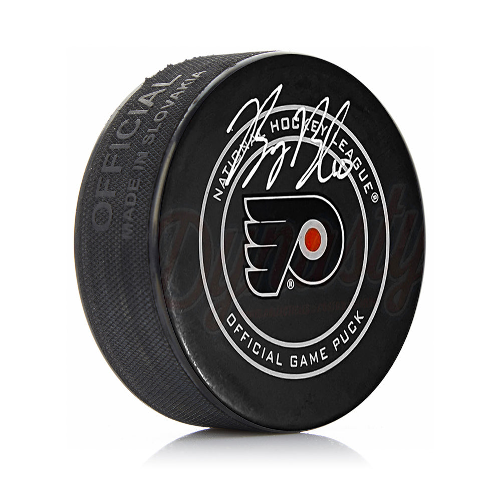 Hockey puck with NHL logo on a white background