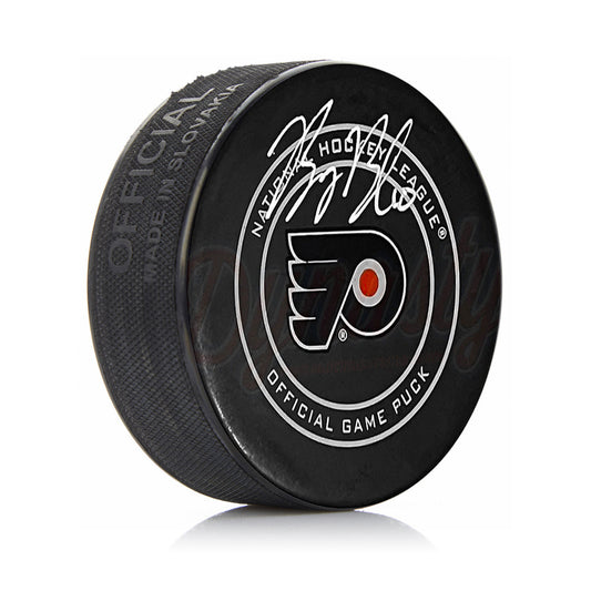 Hockey puck with NHL logo on a white background