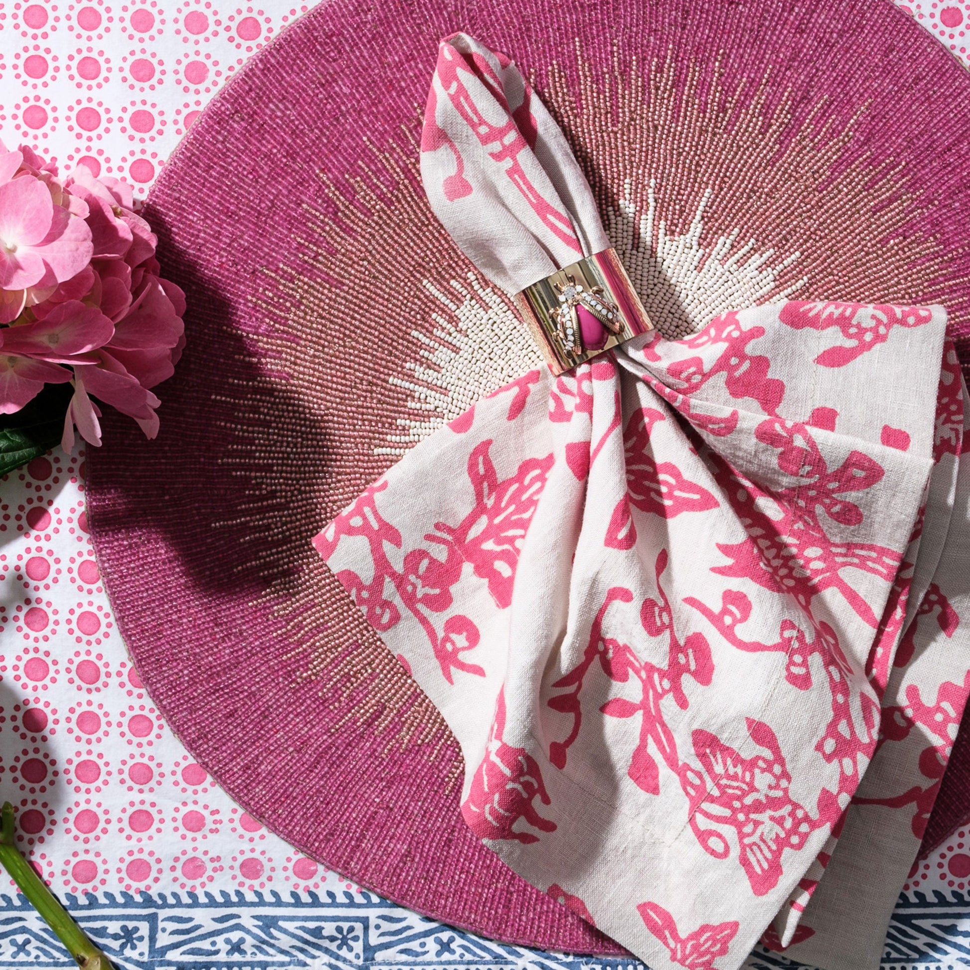 Table setting featuring pink ombre placemat