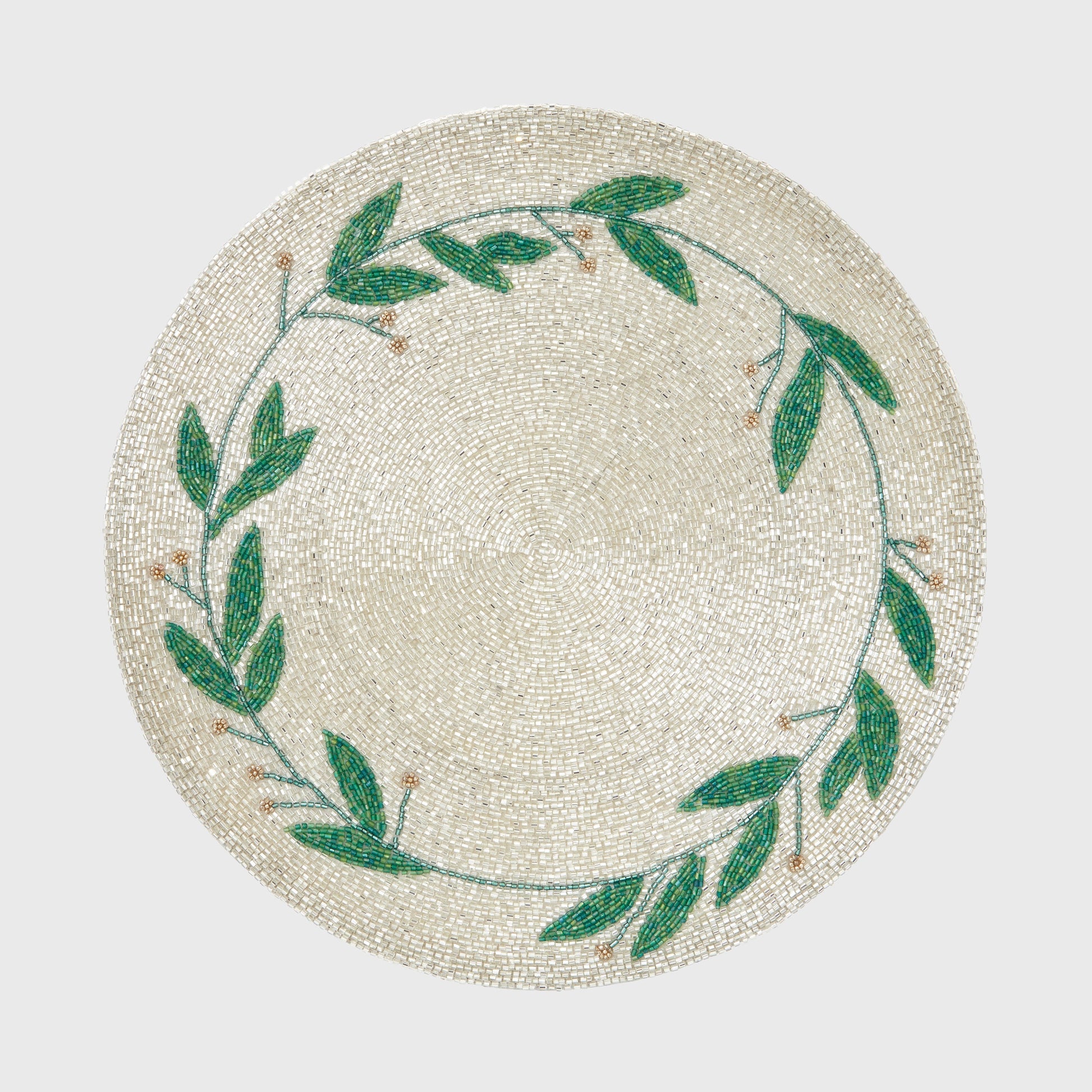 Hand-beaded mistletoe placemat with clear, green and gold glass beads on a soft linen base