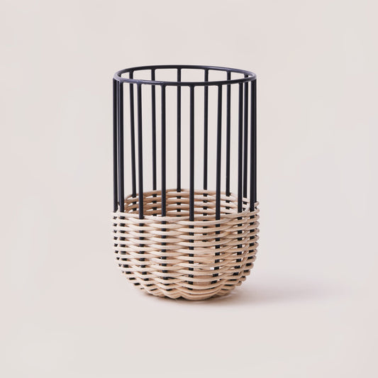 A medium-sized kitchen utensil holder with a minimal design, featuring natural rattan on a powder-coated iron frame.