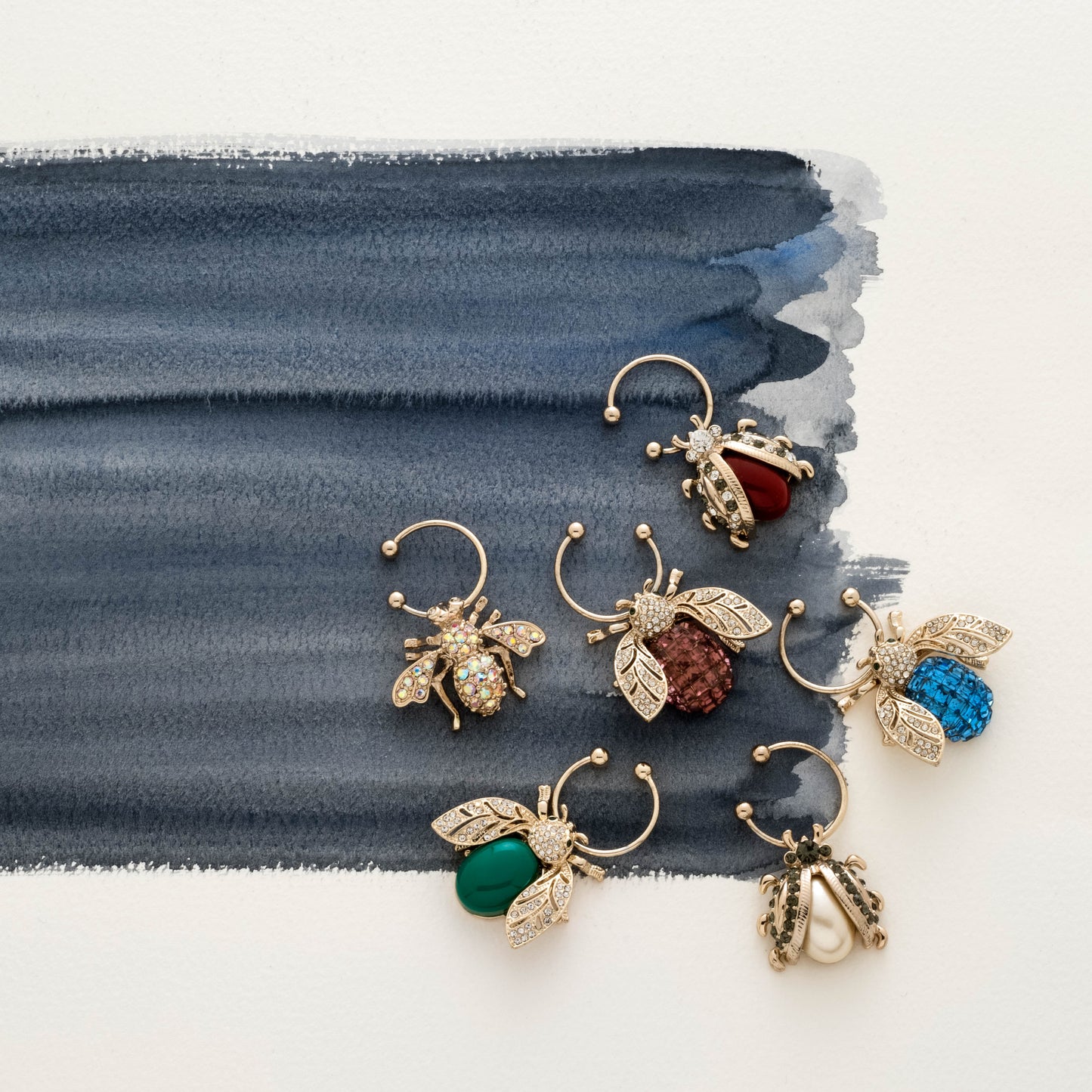 Luxurious Bee Wine Charms Set in Dark Jewel Tones
