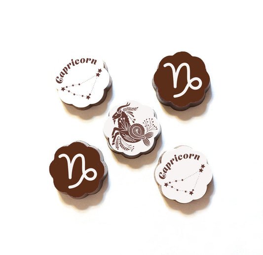 A set of five chocolate pieces with 'Capricorn' and the Capricorn sign decoration.