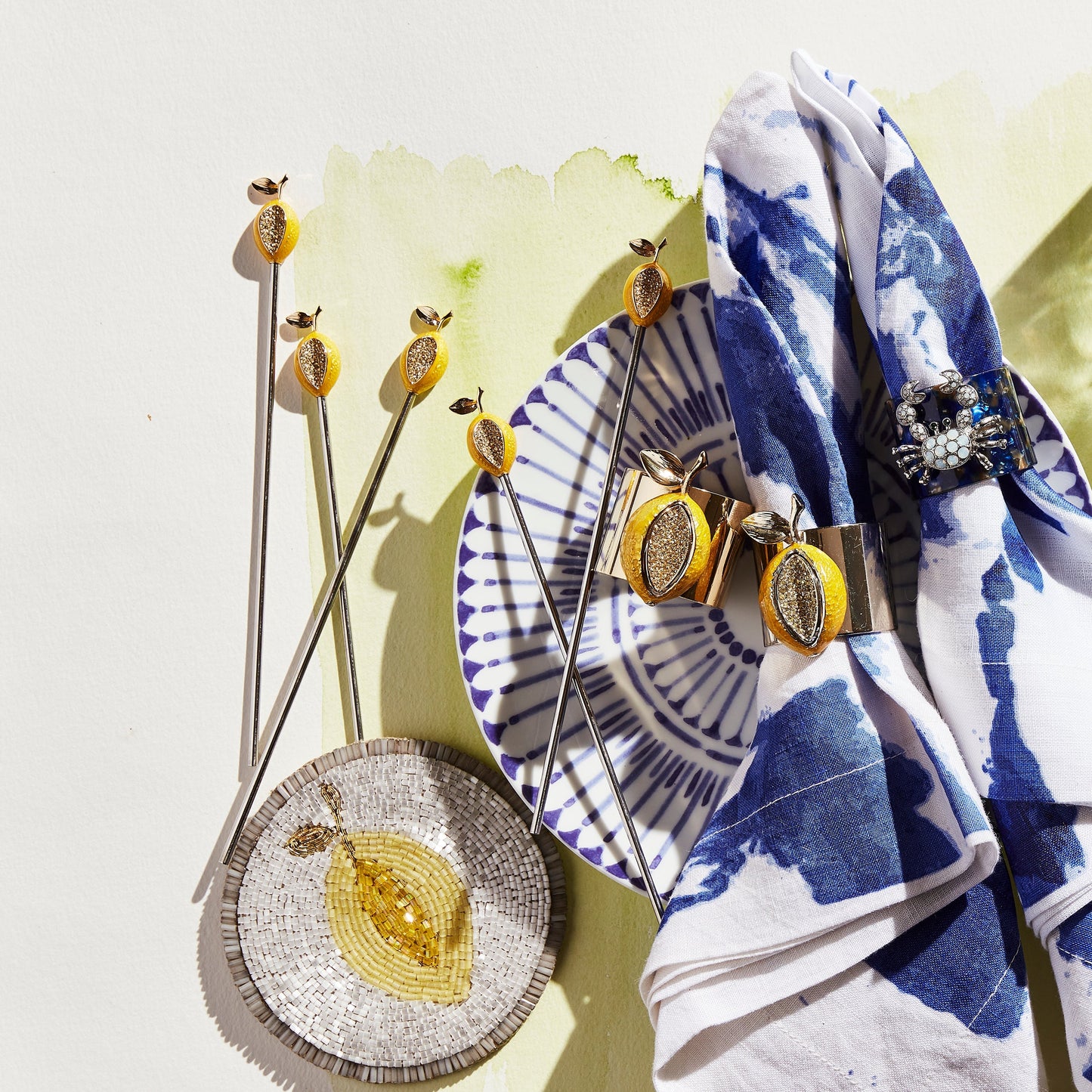 coaster with lemon swizzle stick